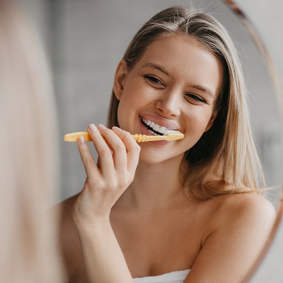 Woman brushing her teeth