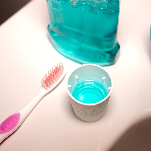fluoride mouthwash on bathroom counter