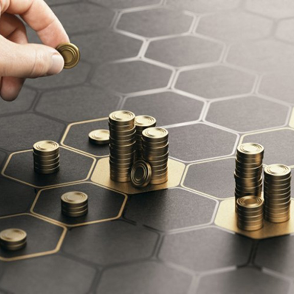Stacks of coins being arranged on hexagonal grid