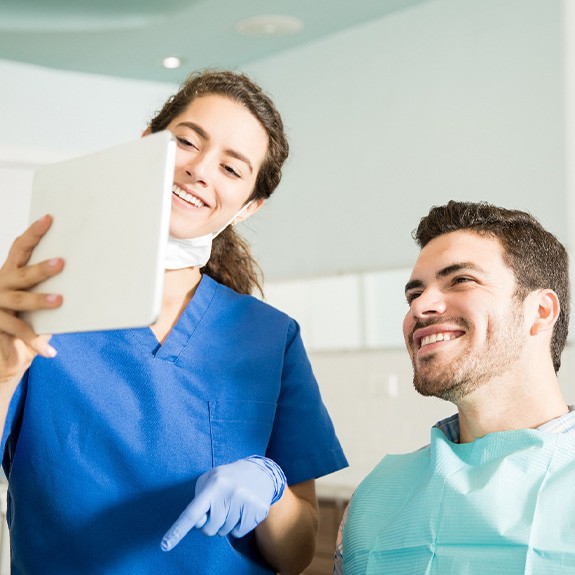 Dentist goes over instructions with patient