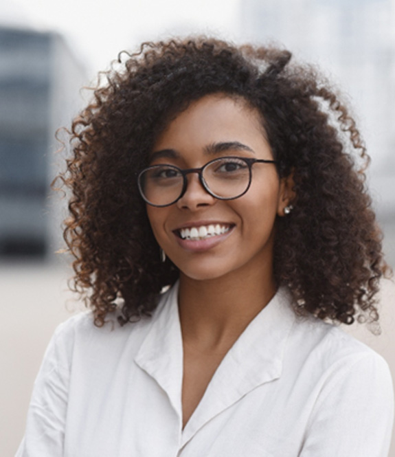 Female professional smiling after seeing her Aetna dentist in Royse City