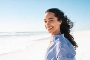Woman smiling at the beach